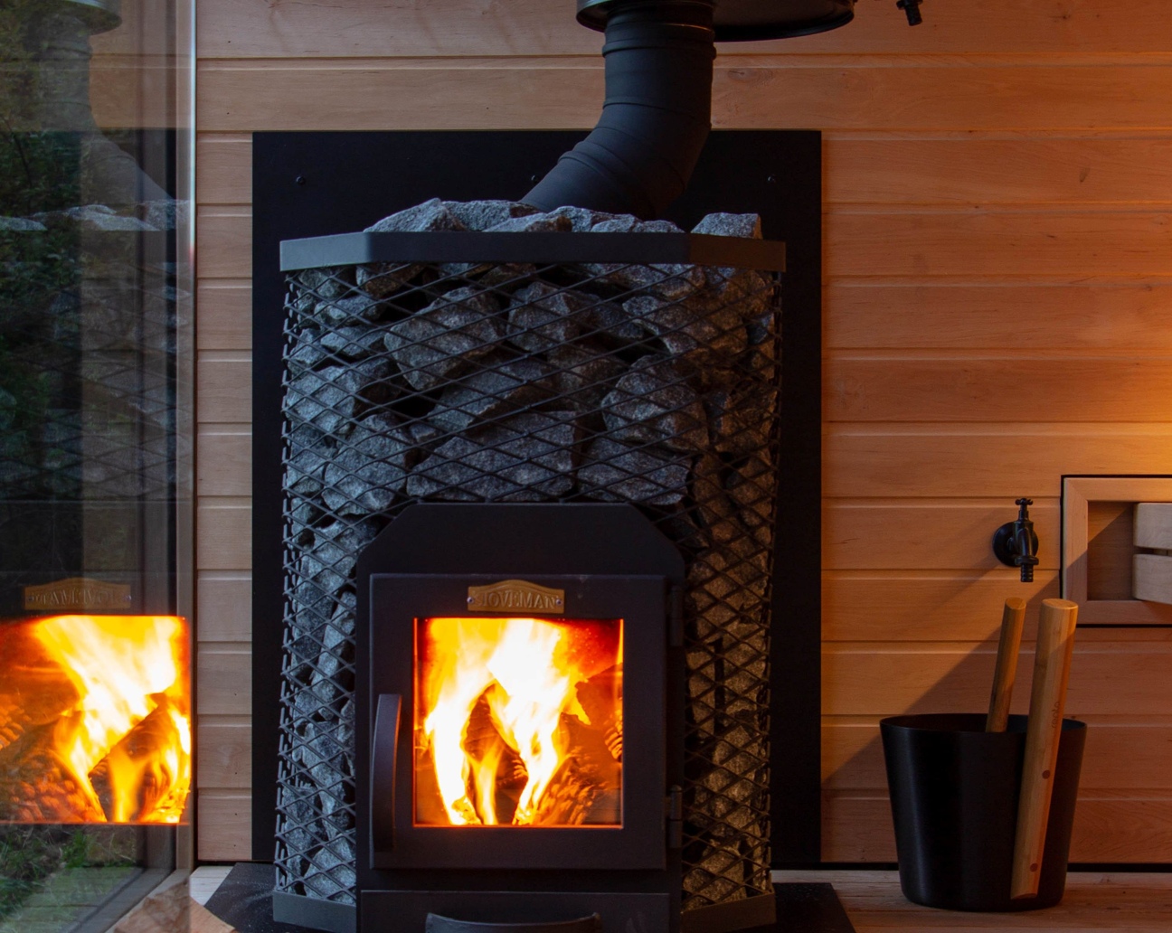 A wood-burning sauna heater inside Inari
